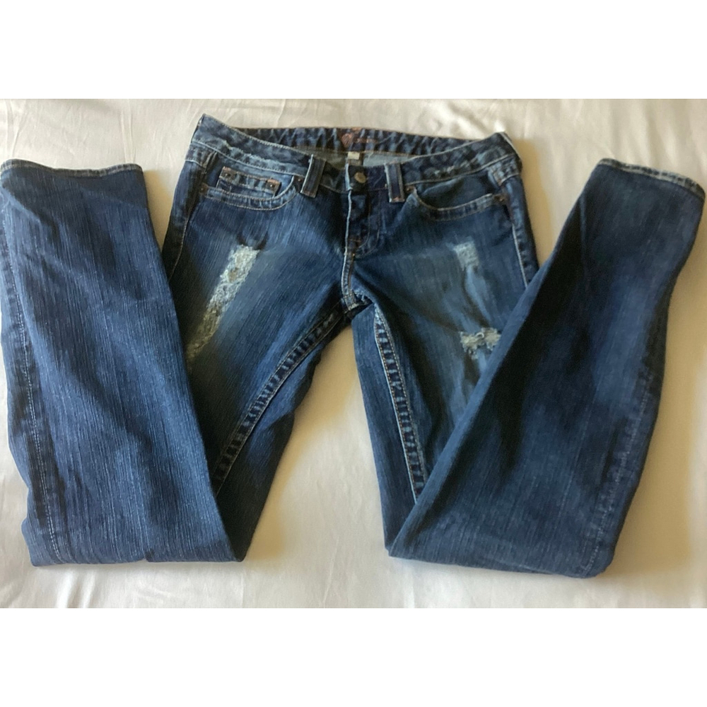 NWOT BEBE Women’s Distressed Denim Jeans with White Rhinestones Back Pockets.